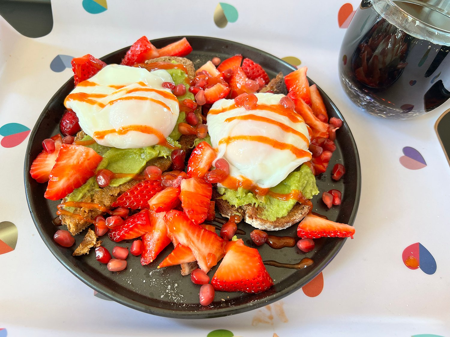sweet and spicy poached eggs on high fibre toast with avocado